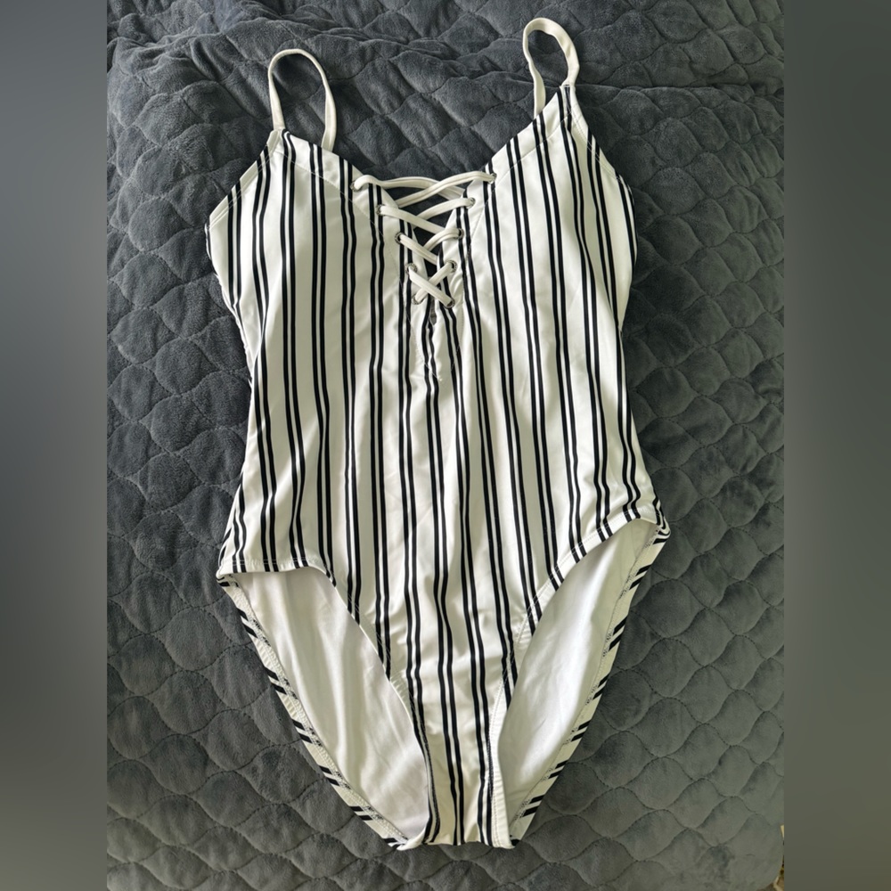 One-piece bathing suit. White with black stripes. Size Large.